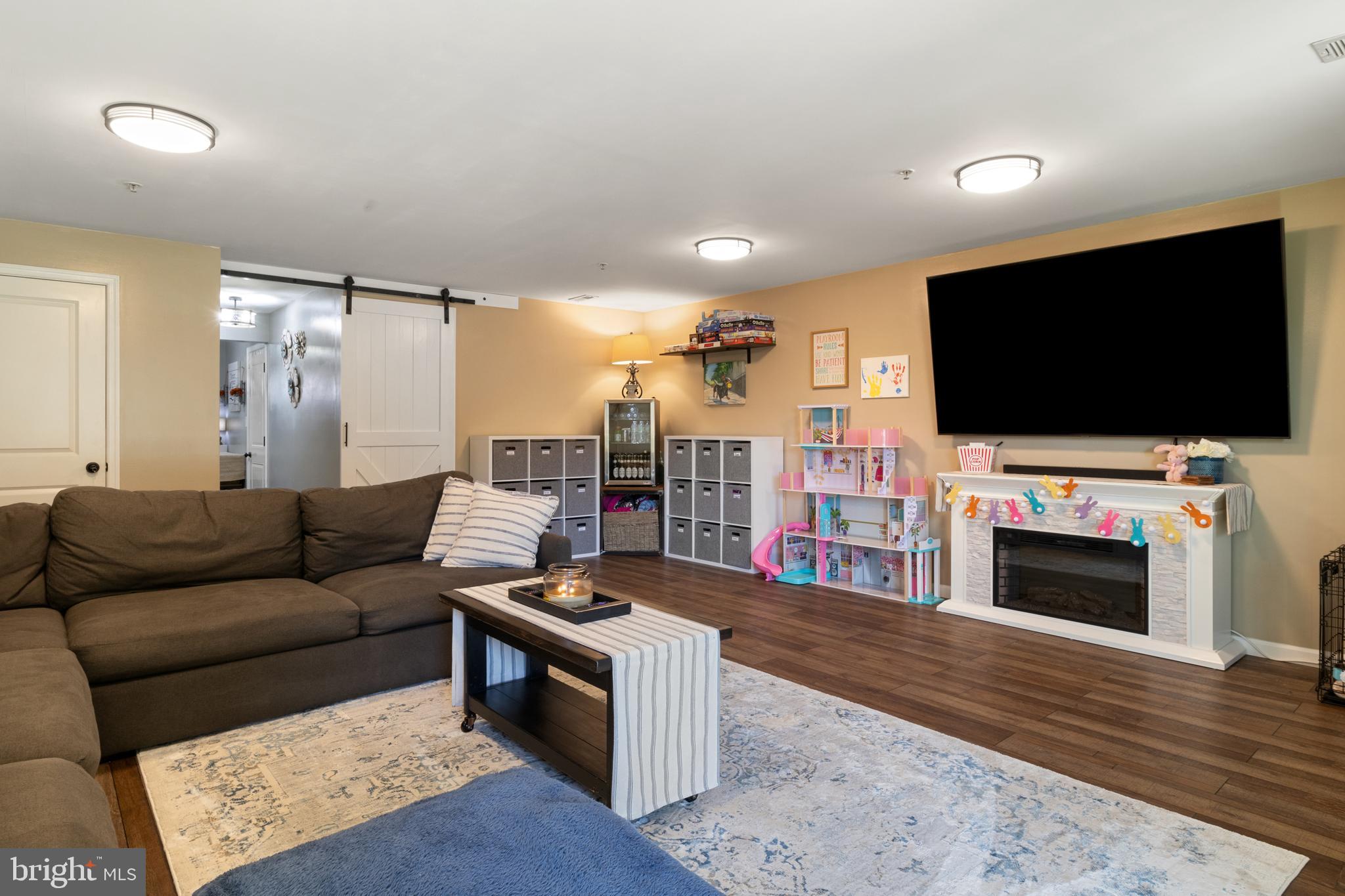 855 Blossom Drive Hanover, PA 17331 - Photo 6 of 53 a living room with furniture and a flat screen tv