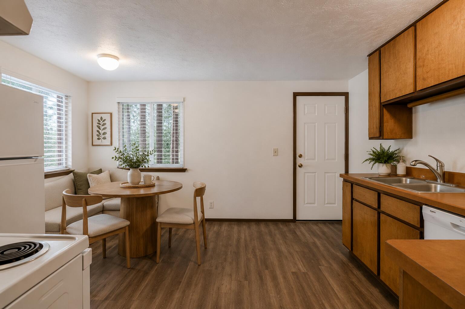 19968 Double Tree Court Bend, OR 97702 - Photo 10 of 28 a view of a dining room with furniture and wooden floor