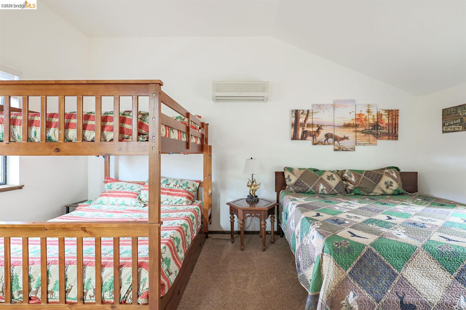 26600 Inyo Drive Cold Springs, CA 95335 - Photo 31 of 38 a bedroom with three beds and a window
