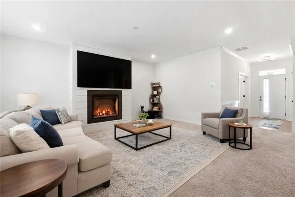 a kitchen with stainless steel appliances a sink a stove top oven a counter space and cabinets