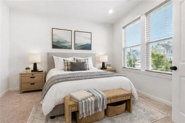 a bed room with a bed and a window