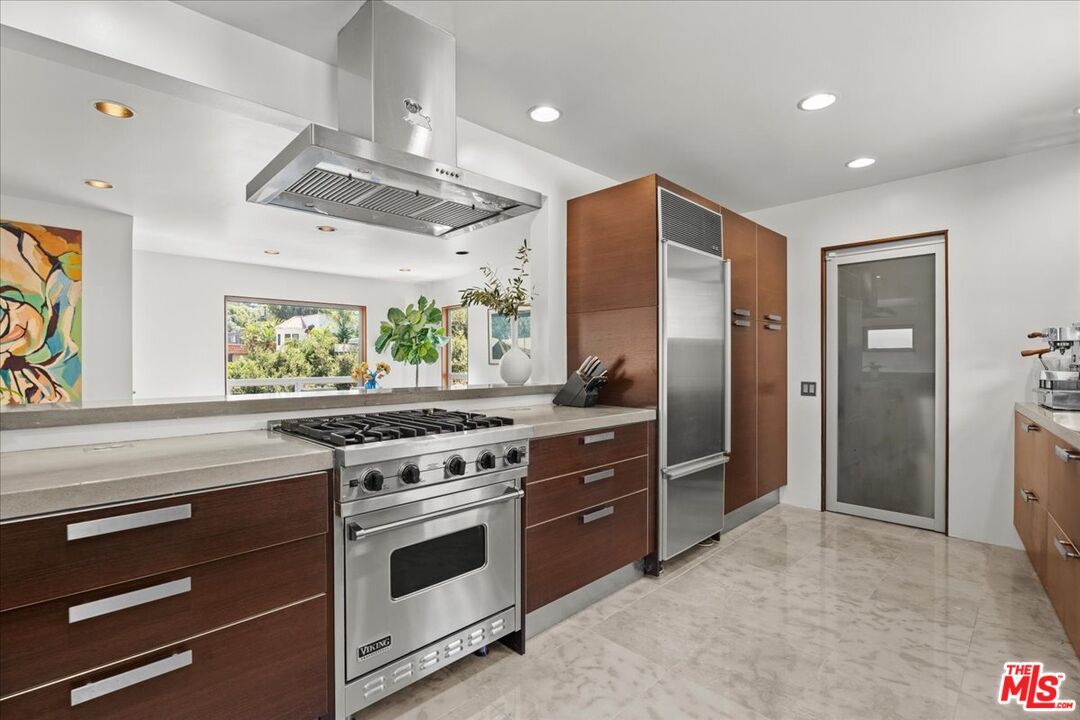3234 Hillock Drive Los Angeles, CA 90068 - Photo 11 of 25 a kitchen with stainless steel appliances granite countertop a stove a refrigerator and a sink