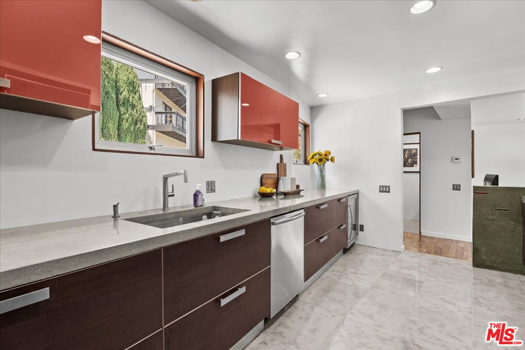 3234 Hillock Drive Los Angeles, CA 90068 - Photo 13 of 25 a large kitchen with stainless steel appliances a sink stove and cabinets