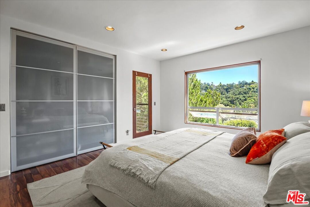 3234 Hillock Drive Los Angeles, CA 90068 - Photo 16 of 25 a bedroom with a bed and a window