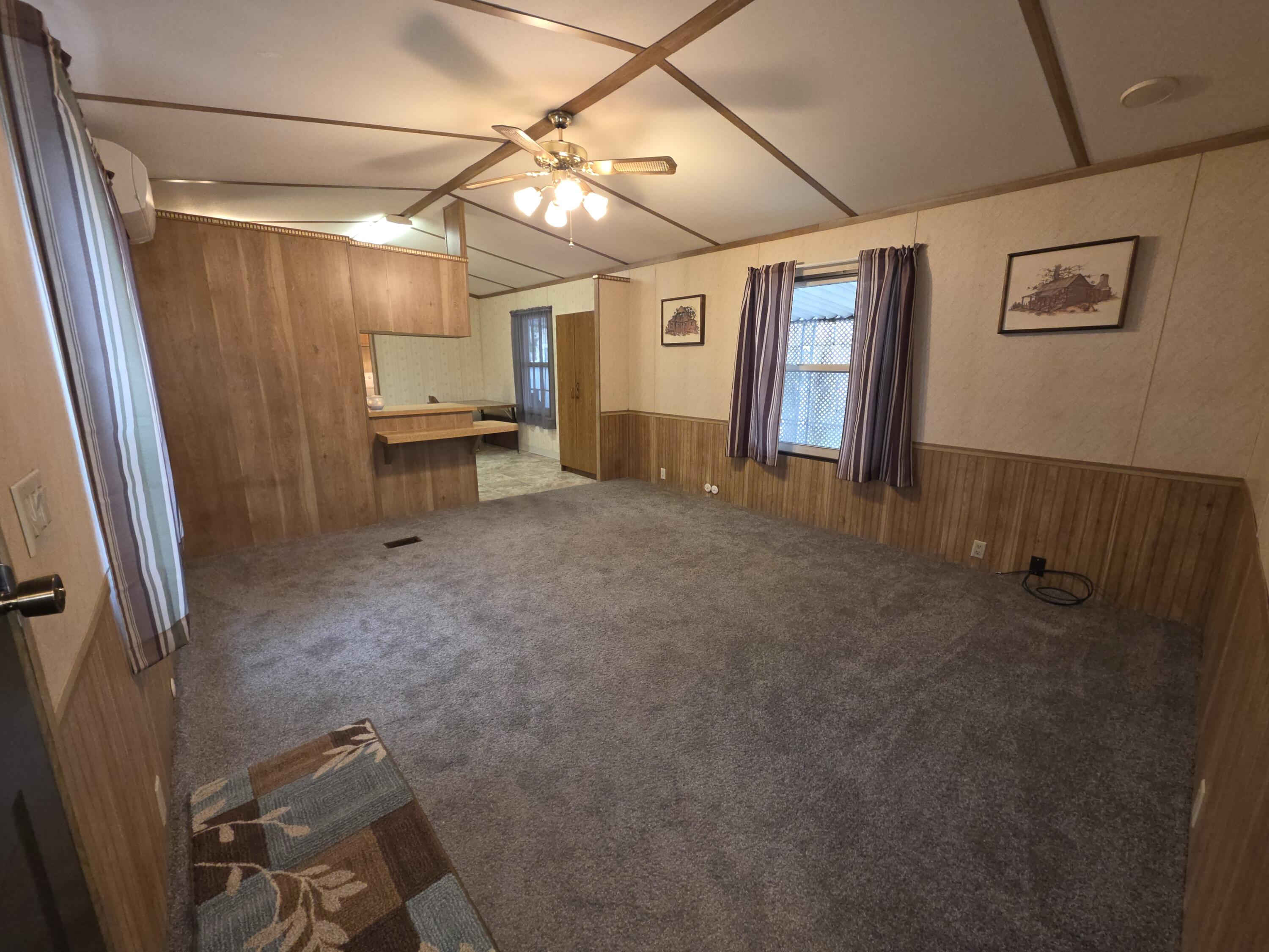 301 Freeman Road, Unit 30 Central Point, OR 97502 - Photo 2 of 26 a view of a livingroom with furniture and a window