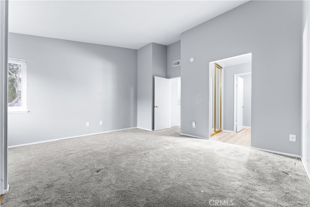 83 Weepingwood, Unit 35 Irvine, CA 92614 - Photo 12 of 19 a view of an empty room with closet and a window