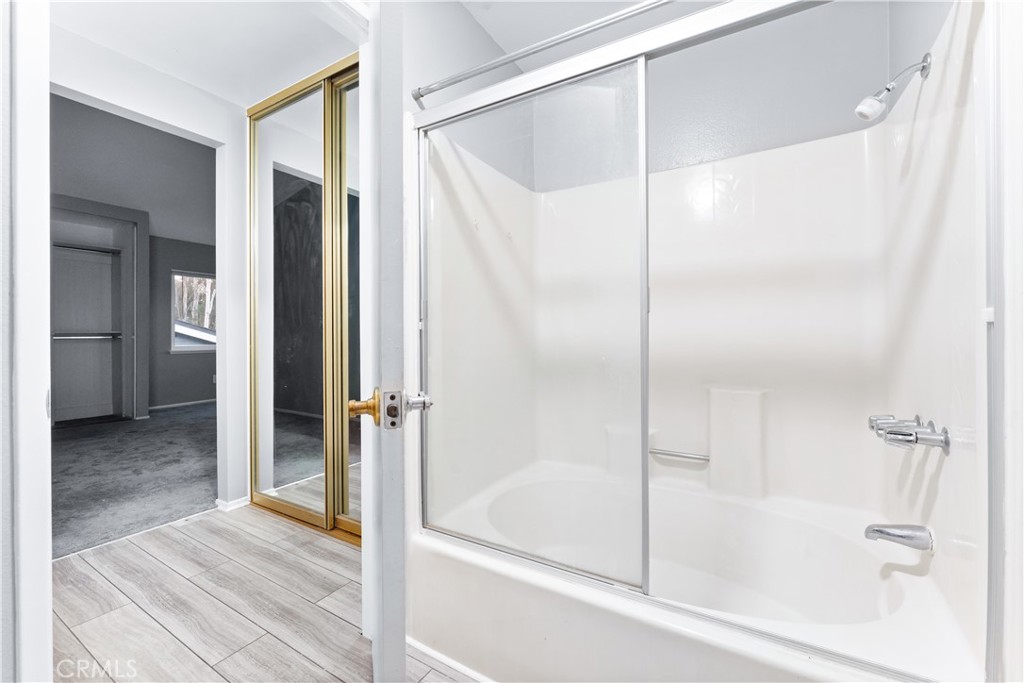 83 Weepingwood, Unit 35 Irvine, CA 92614 - Photo 14 of 19 a bathroom with a shower and a bath tub