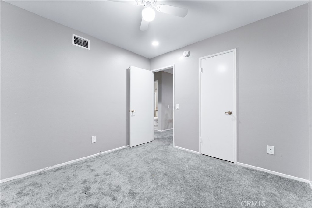83 Weepingwood, Unit 35 Irvine, CA 92614 - Photo 15 of 19 a view of an empty room and a chandelier fan