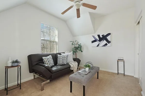 a bedroom with furniture and a window