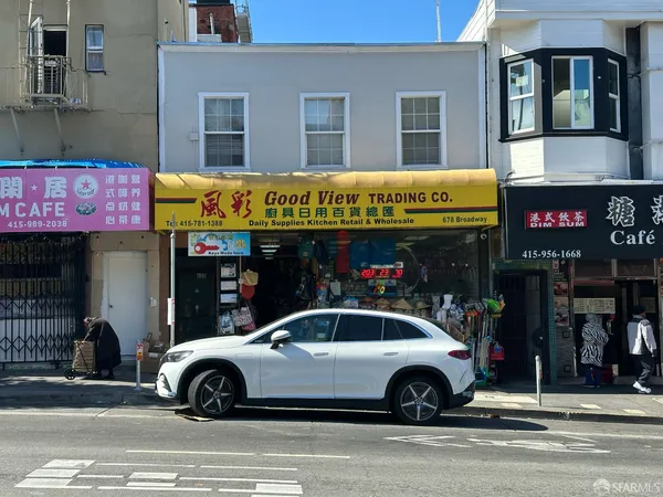 a cars parked in front of a store