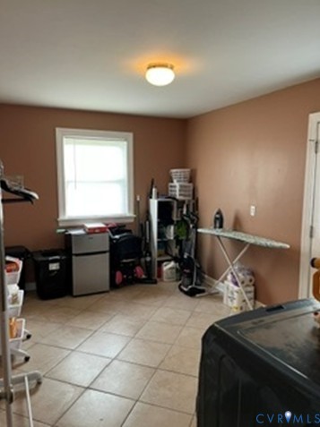 3732 Birdwood Road Richmond, VA 23234 - Photo 26 of 28 a bed room with a bed and a television