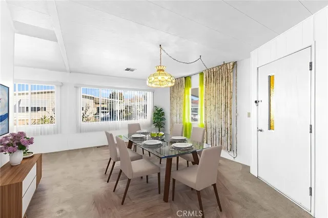 a view of a dining room with furniture window and outside view
