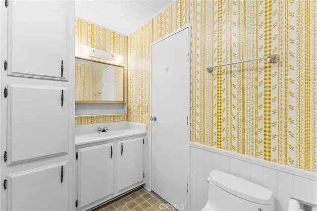 a view of a bathroom with a sink and a window