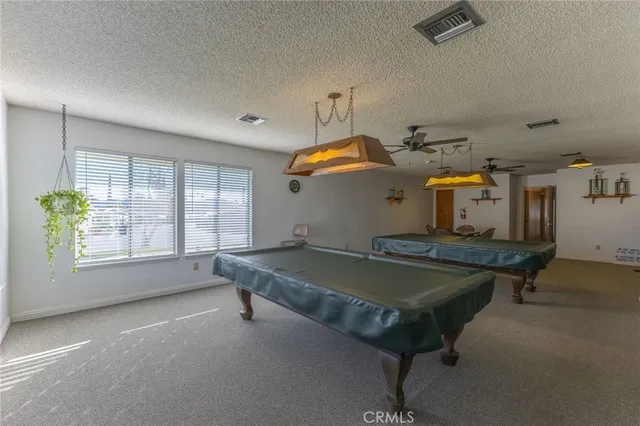 a view of an empty room with windows