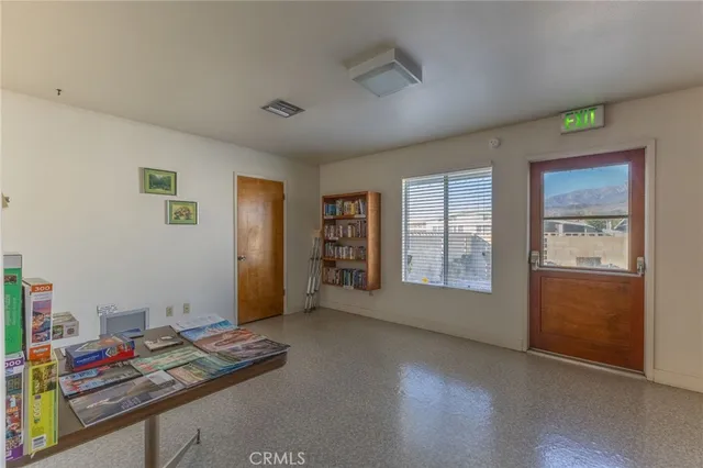 a view of a house with swimming pool and sitting area