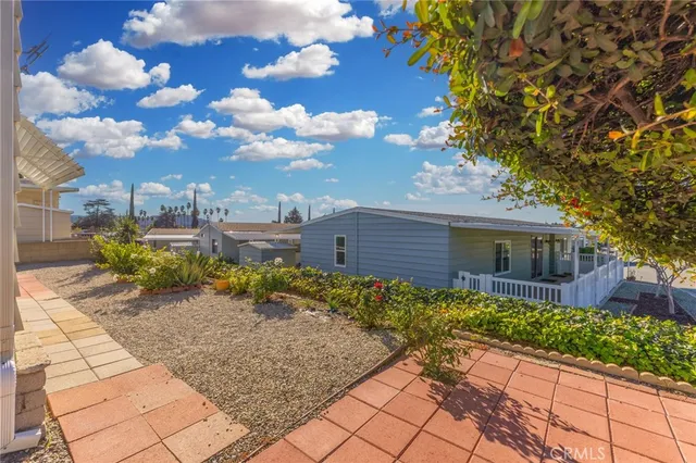 a view of a backyard with large trees