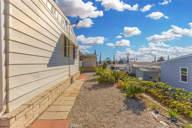 a view of a pathway with a yard