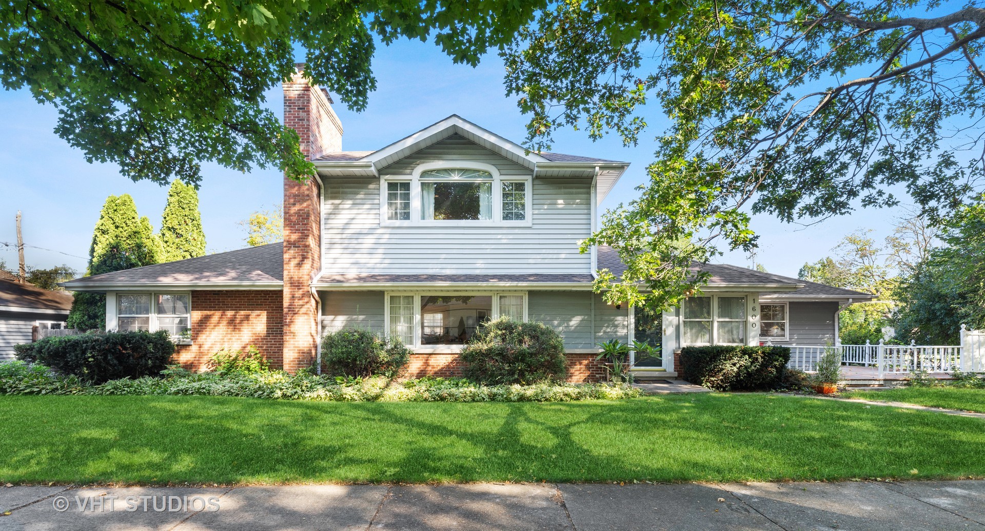 1600 Good Avenue Park Ridge, IL 60068 - Photo 1 of 20 a front view of a house with a garden and plants