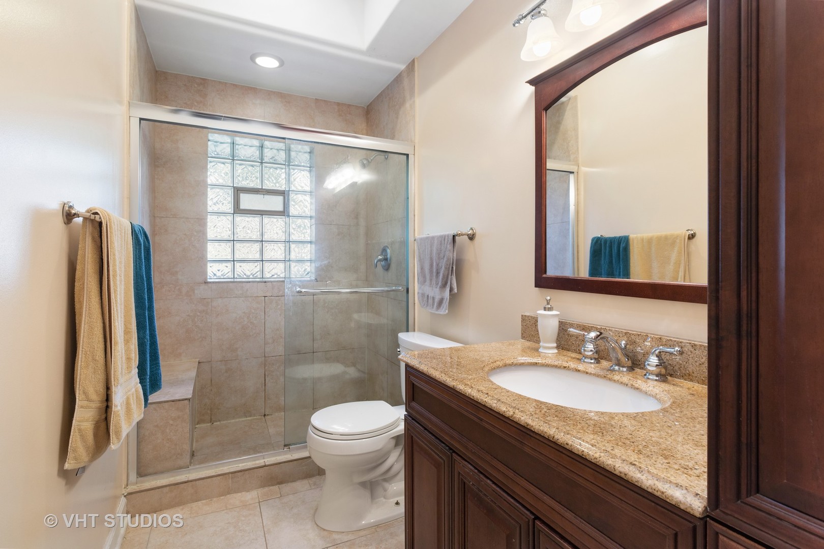 1600 Good Avenue Park Ridge, IL 60068 - Photo 11 of 20 a bathroom with a granite countertop sink toilet and shower