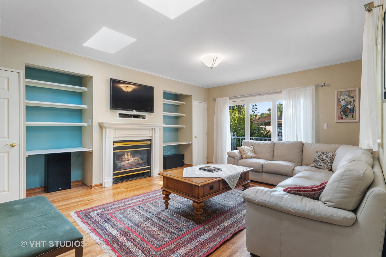 1600 Good Avenue Park Ridge, IL 60068 - Photo 4 of 20 a living room with fireplace furniture and a flat screen tv