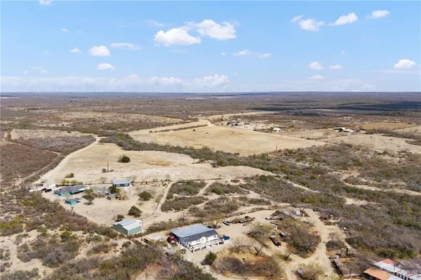 an aerial view of residential building and trees