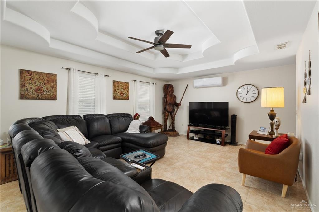 116 Margarito Street Roma, TX 78584 - Photo 3 of 29 a living room with furniture and a flat screen tv