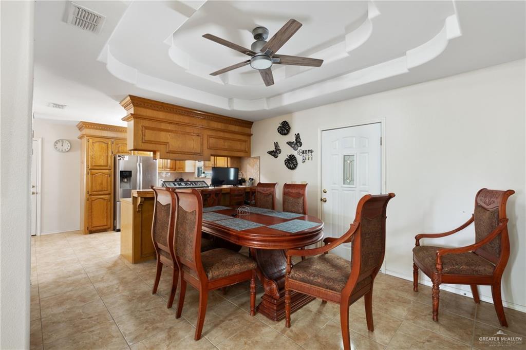 116 Margarito Street Roma, TX 78584 - Photo 4 of 29 a view of a dining room with furniture and a large window