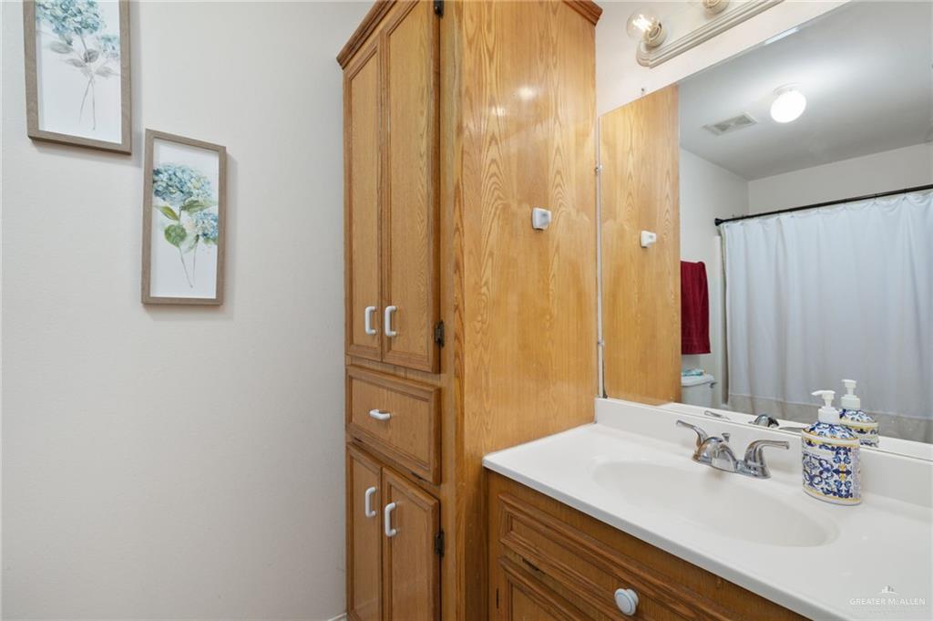 116 Margarito Street Roma, TX 78584 - Photo 10 of 29 a bathroom with a sink and a mirror