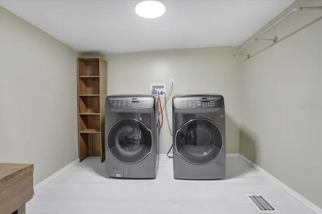 a utility room with dryer and washer