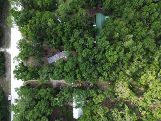 a view of a house with a tree