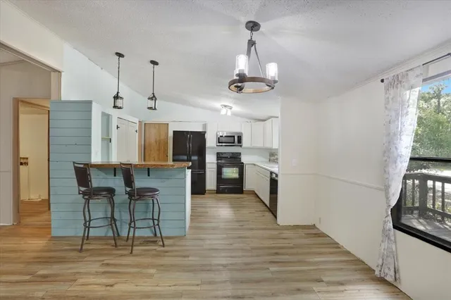a view of kitchen and windows