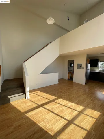 a view of a livingroom with a stove and furniture