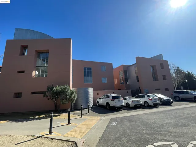 a view of a patio with table and chairs and potted plants