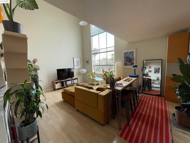 a view of a livingroom with furniture and a flat screen tv