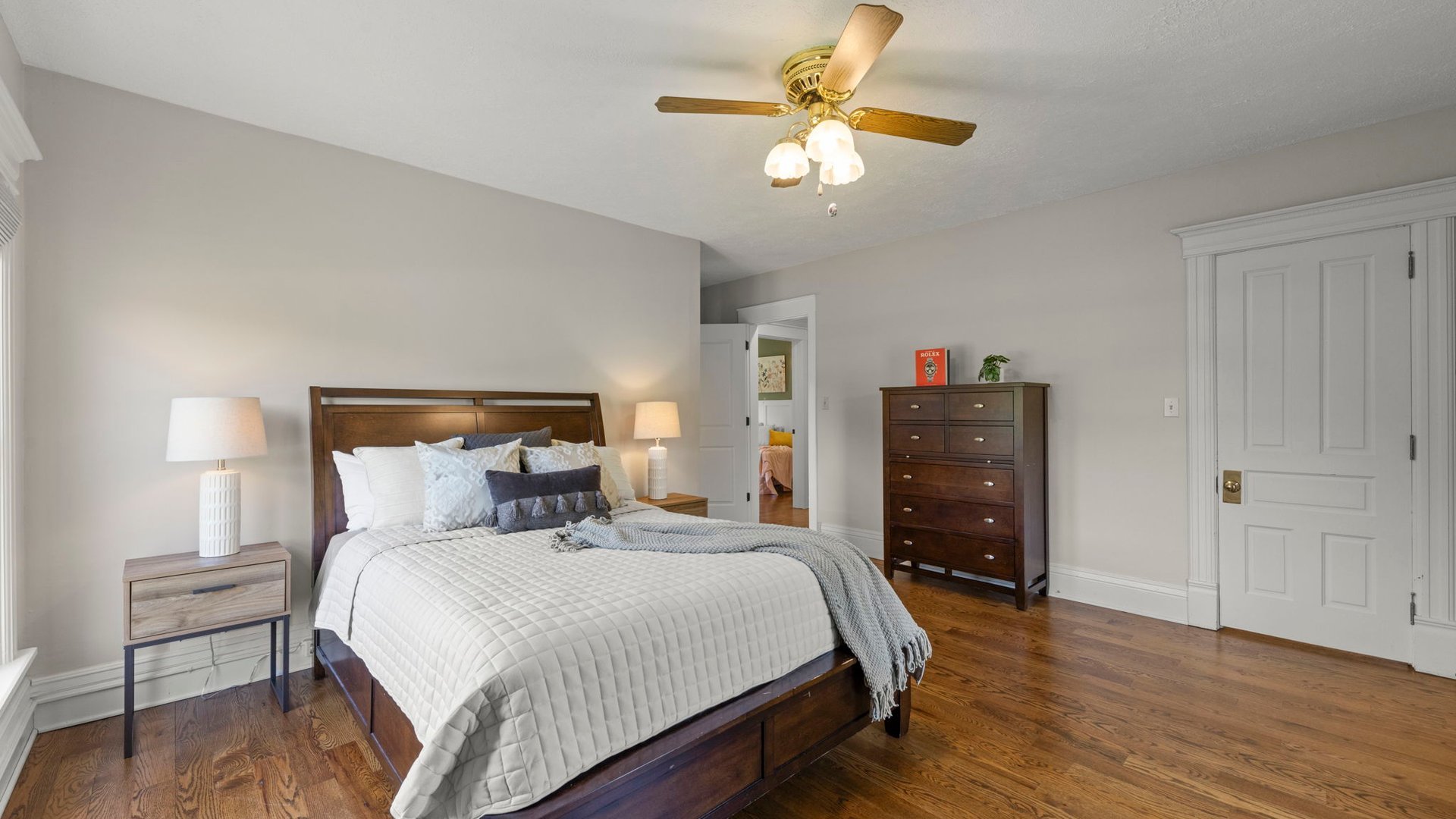 3614 Wolf Road Oswego, IL 60543 - Photo 27 of 56 a bedroom with a bed and wooden floor