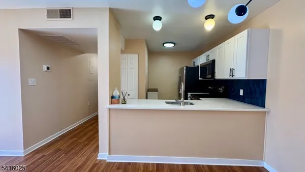 a kitchen with a sink and a stove