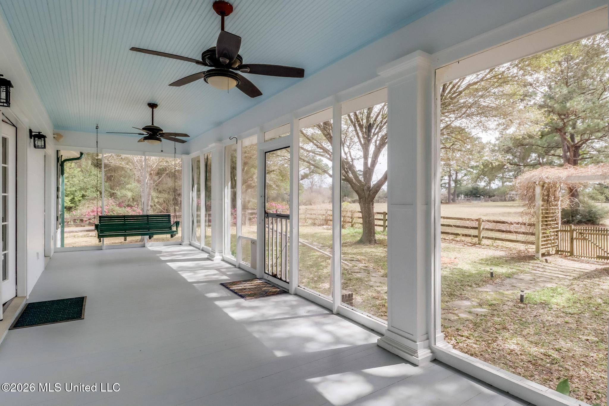 23676 East Dubuisson Road Pass Christian, MS 39571 - Photo 5 of 65 Main house front screened porch