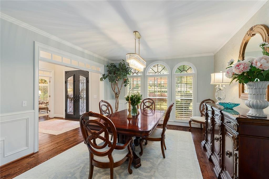 219 Morning Mist Way Woodstock, GA 30189 - Photo 12 of 72 a view of a dining room with furniture window and wooden floor