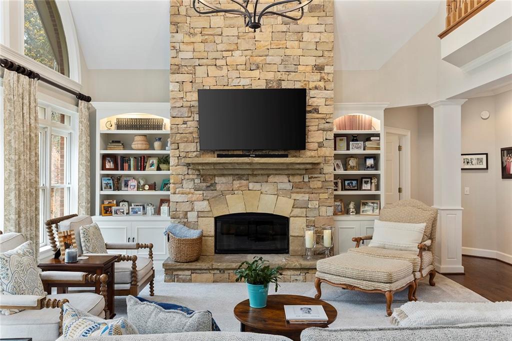 219 Morning Mist Way Woodstock, GA 30189 - Photo 19 of 72 a living room with furniture a fireplace and a flat screen tv