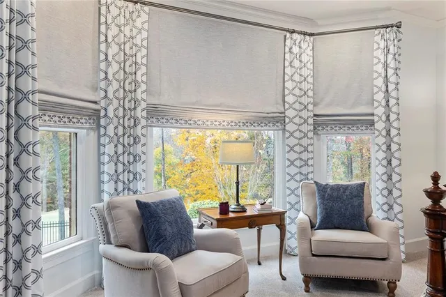 a livingroom with workspace and a window