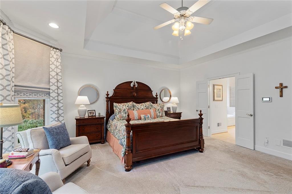 219 Morning Mist Way Woodstock, GA 30189 - Photo 33 of 72 a living room with furniture a chandelier and a window
