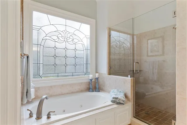 a living room with furniture a rug and a book shelf