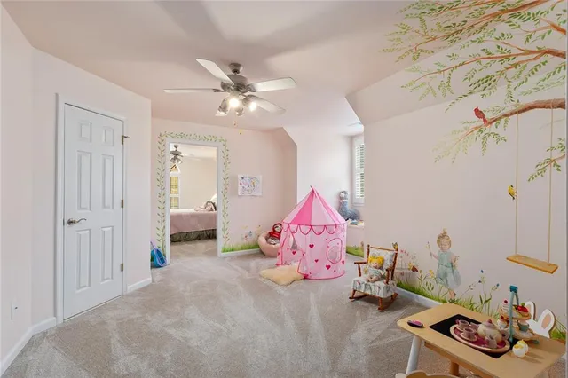 a building outdoor space with patio furniture and potted plants