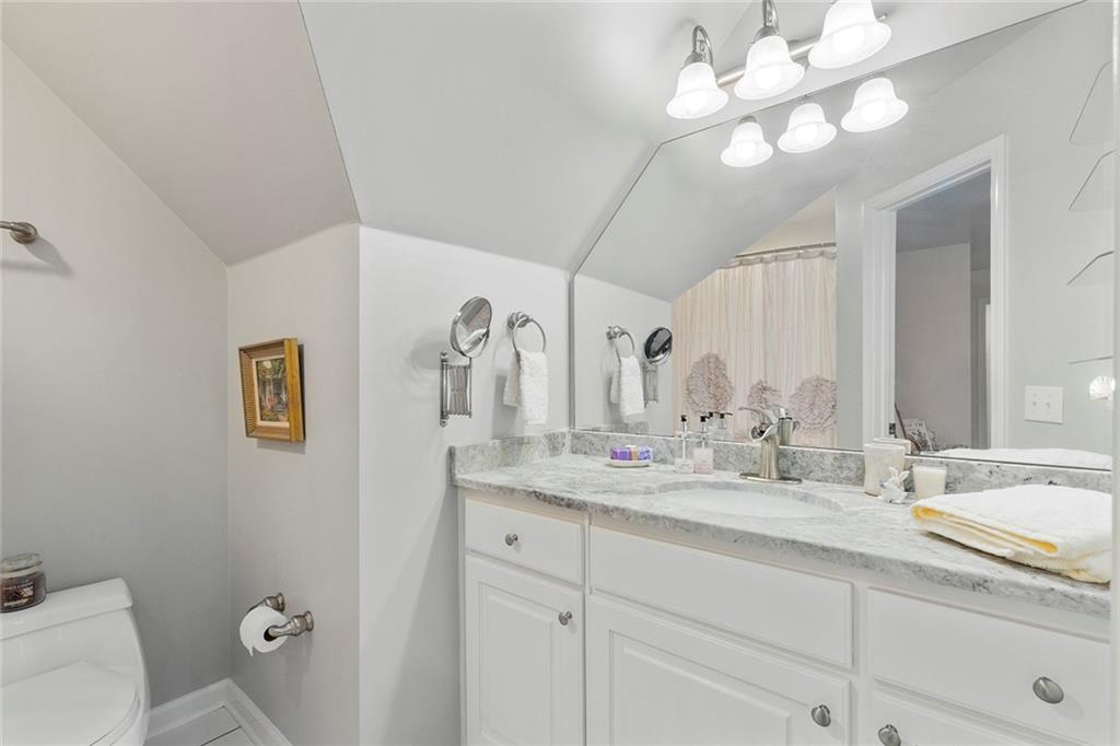 219 Morning Mist Way Woodstock, GA 30189 - Photo 46 of 72 a bathroom with a sink vanity granite and toilet