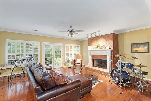an aerial view of a house with a yard and lake view