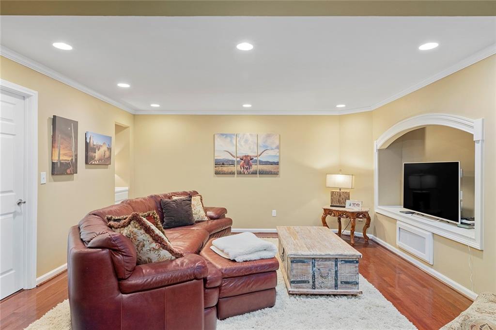 219 Morning Mist Way Woodstock, GA 30189 - Photo 51 of 72 a living room with furniture and a flat screen tv