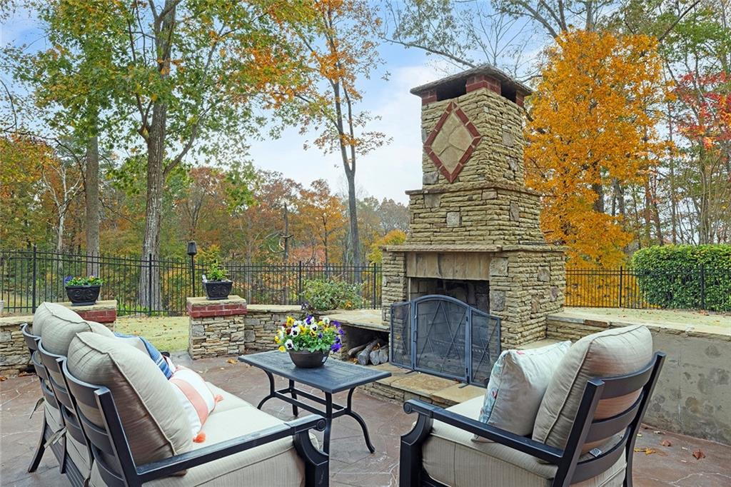 219 Morning Mist Way Woodstock, GA 30189 - Photo 58 of 72 a view of a patio with couches table and chairs