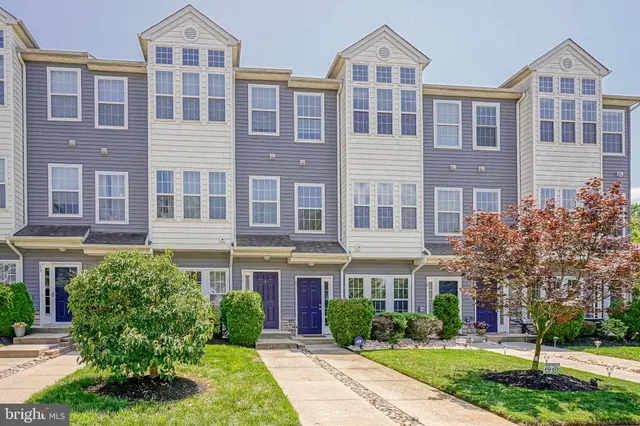 a front view of a building with garden