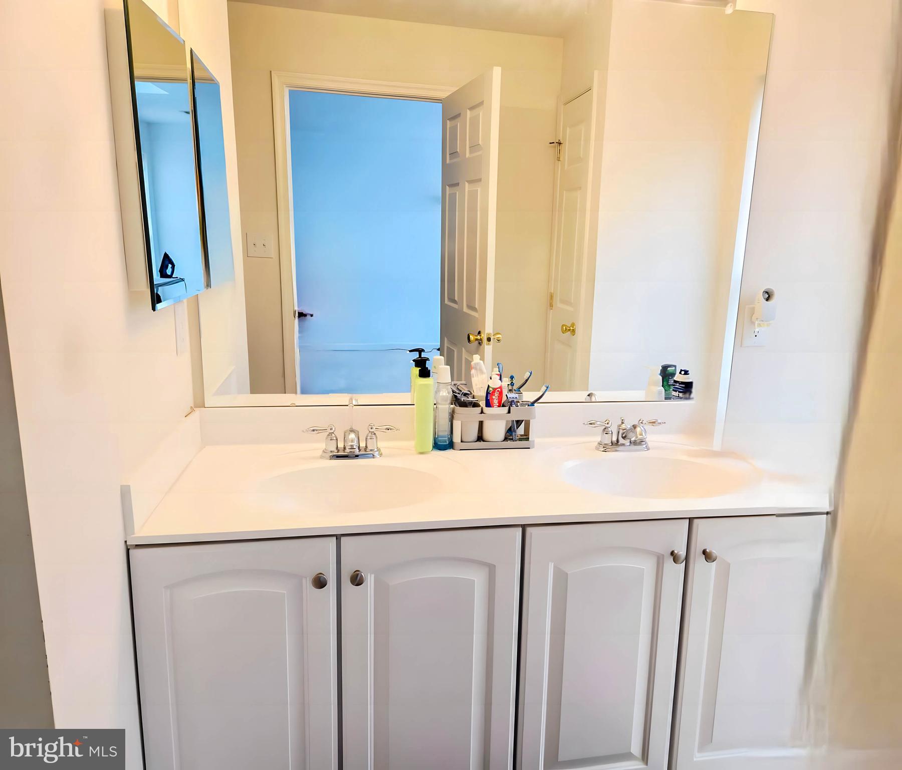 7 Fox Court Riverside, NJ 08075 - Photo 14 of 21 a bathroom with a sink and a mirror