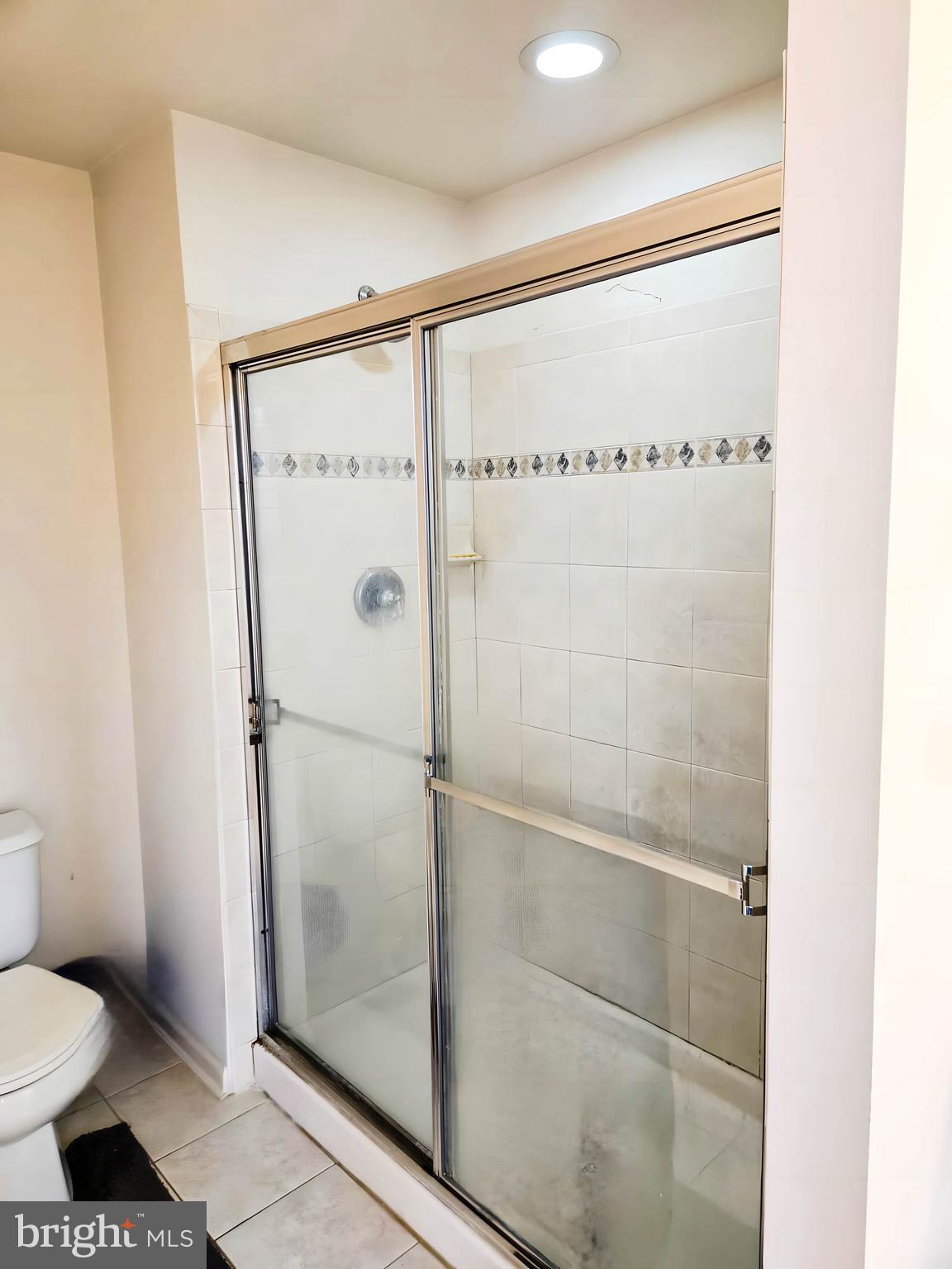 7 Fox Court Riverside, NJ 08075 - Photo 16 of 21 a bathroom with a shower and a toilet